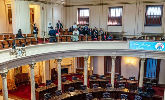 Students gathered on mezzanine level of New Jersey state senate assembly room