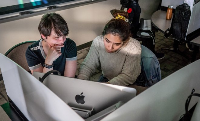 Student and professor in computer lab