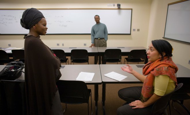 People in discussion in classroom.