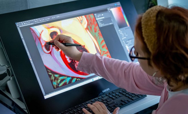 Illustration student painting on a digital screen.