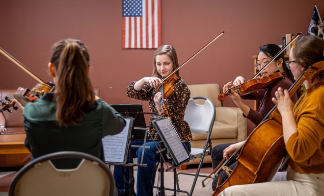 A string quartet performs.