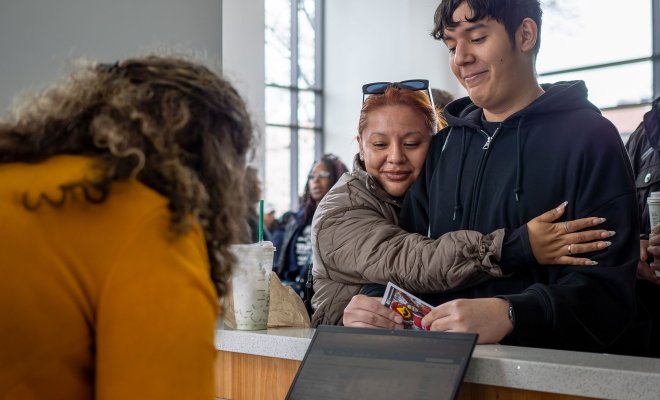 A mother hugs her son with emotion and pride during Montclair State University’s Accepted Student Day.