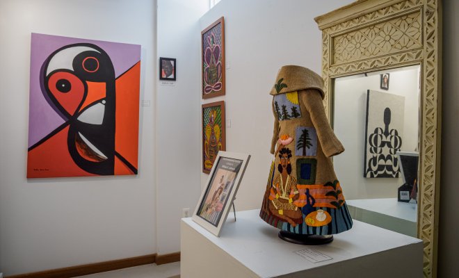 Gallery is shown with a waiting, a garment with pictured sewn and a picture frame. 