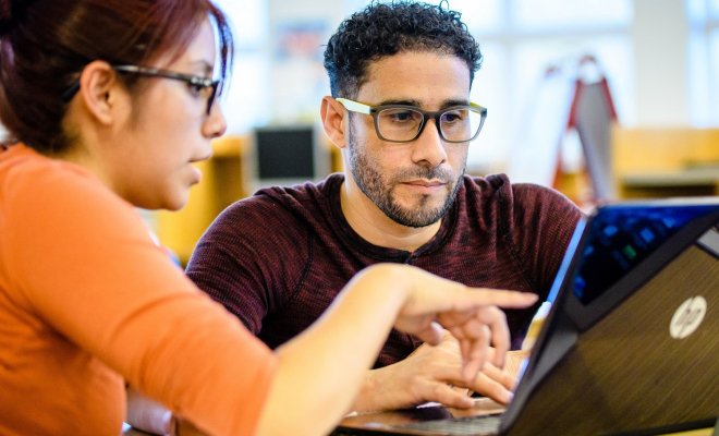 A student engages in a class project at Montclair State University.