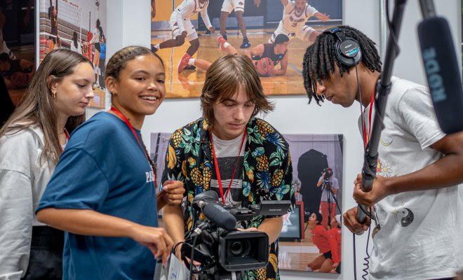 High school students use advanced cameras as part of the Sports Communication program during Pre-College Summer.
