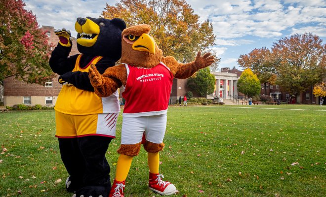Two mascots are pictured alongside one another. 