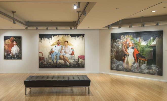 Photo of paintings from "Ajamu Kojo’s Black Wall Street: A Case for Reparations" in the University Galleries.