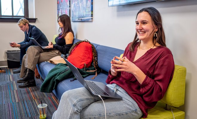 A student sits at a computer on the campus of Montclair State University.