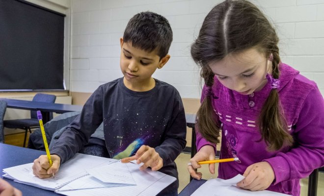 Young children working on a school project.