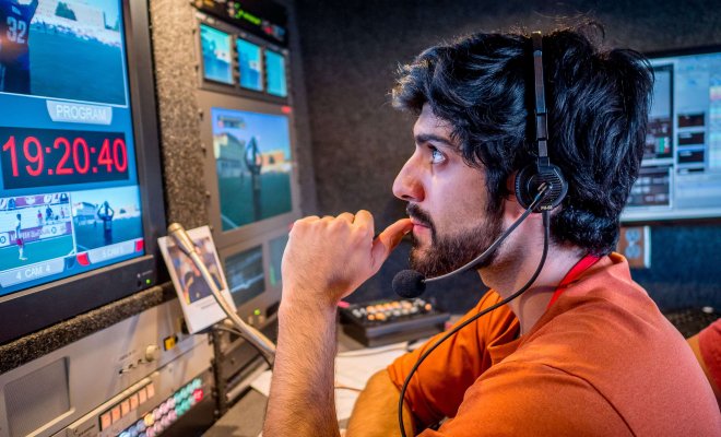 A student produces a soccer game broadcast at Montclair State University