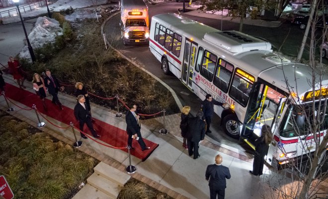 People walking into the shuttle on campus.