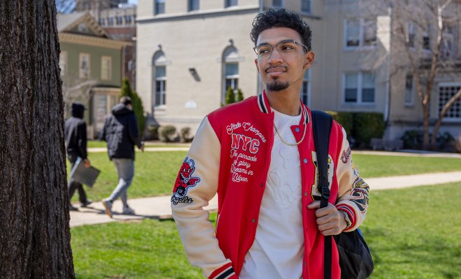 Bryce Antonie wearing a red leather jacket with white sleeves.