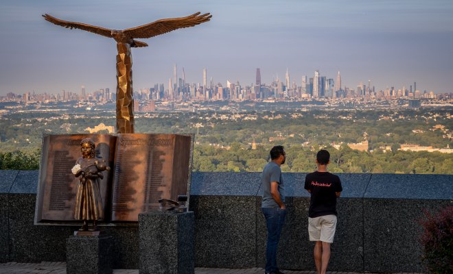 Visitors take in the Manhattan skyline view from the Eagle Rock Observation Deck.