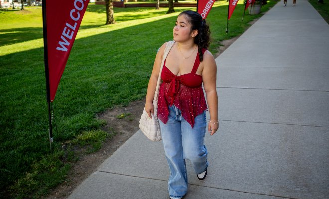 Ileana Zuniga walks along the Student Quad during Orientation Week.