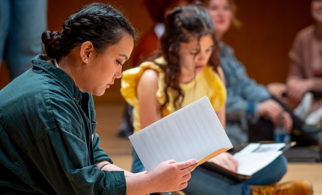 Students studying music composition