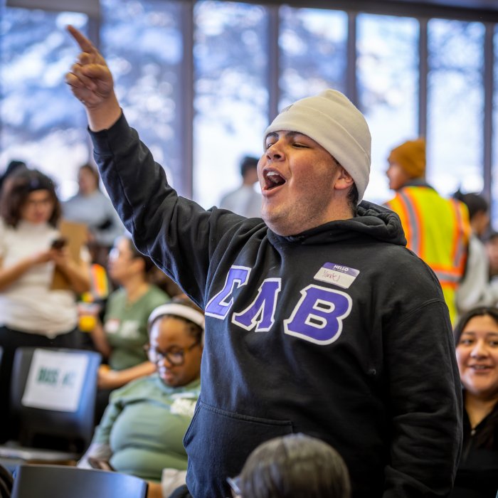 Man is seen pointing up yelling. 
