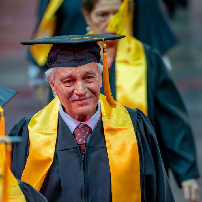 Man walking at commencement. 