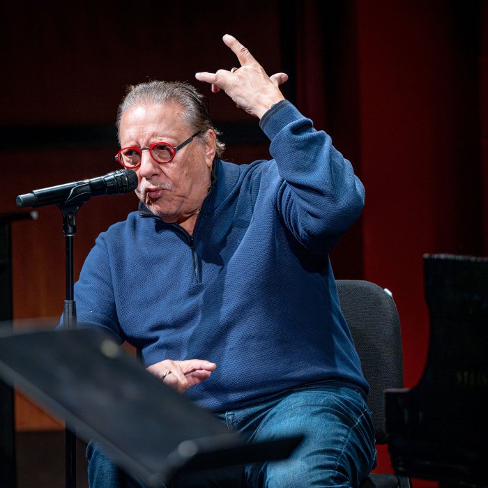Arturo Sandoval gestures with both hands as he scat sings.