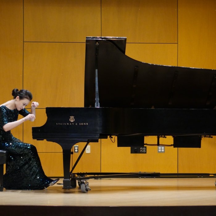 Piano student on stage in Leshowitz Recital Hall