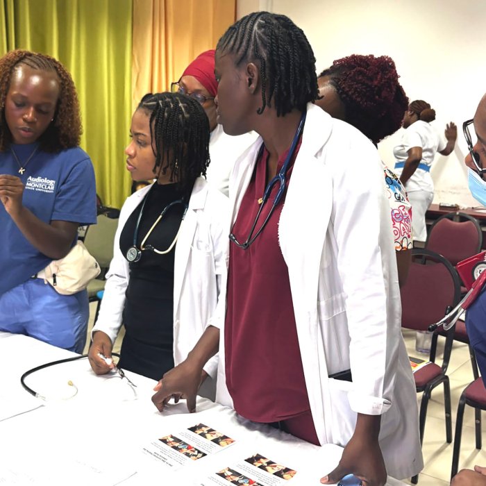 Audiology student Kayla Pierre educates nurses in Dominica on hearing health.