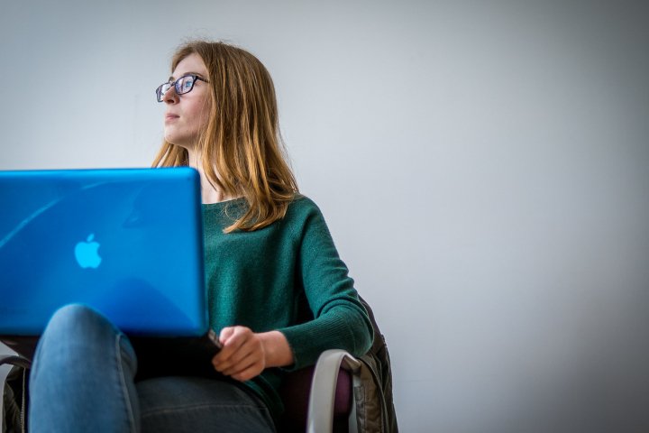 Student Sitting with Computer on Lap