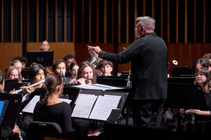 University Wind Symphony on stage performing