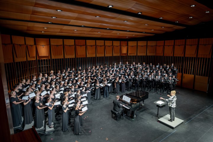 Chorale on stage with Dr. Buchanan and Accompanist