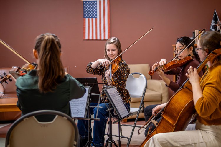 A string quartet performs.