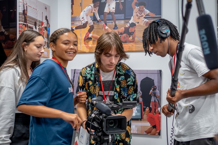 High school students use advanced cameras as part of the Sports Communication program during Pre-College Summer.