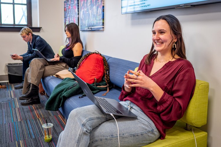 A student sits at a computer on the campus of Montclair State University.