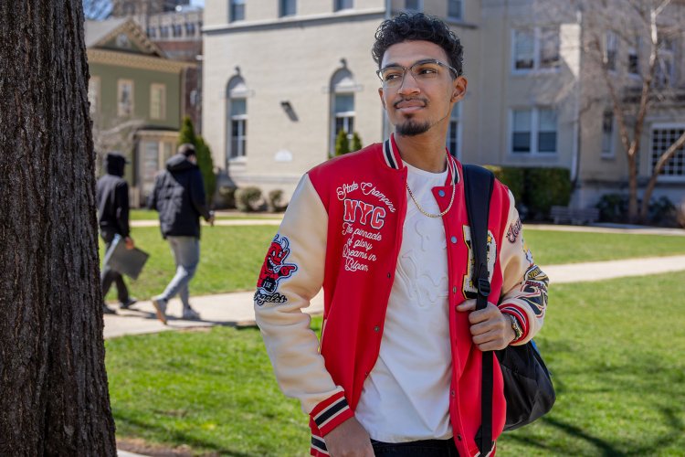 Bryce Antonie wearing a red leather jacket with white sleeves.