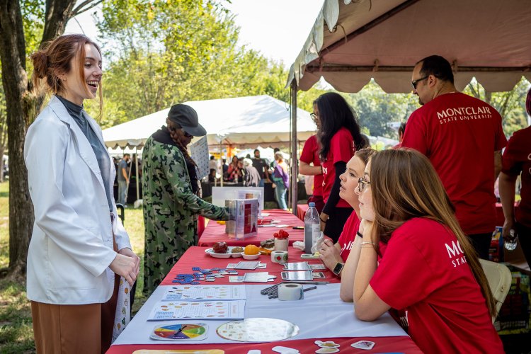 Two people speaking at a nutrition booth