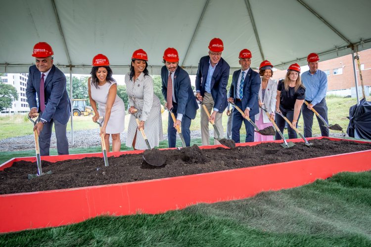 President Jonathan Koppell and University leadership pose with shovels at the building groundbreaking