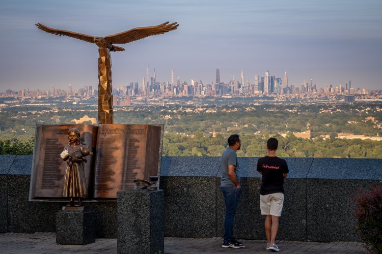 Visitors take in the Manhattan skyline view from the Eagle Rock Observation Deck.