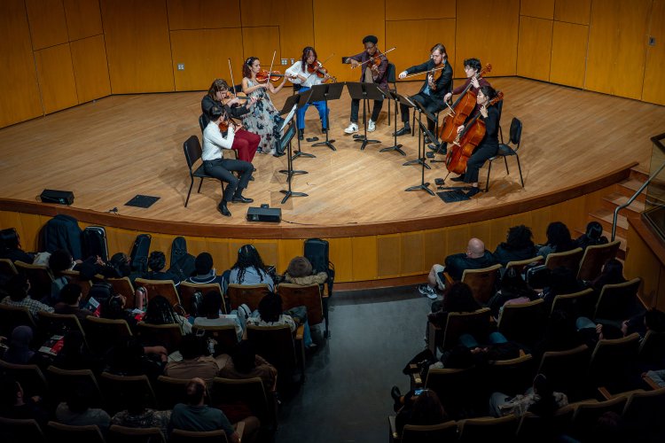 Cali students on stage in Leshowitz Hall