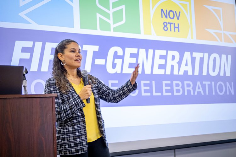 A speaker giving a presentation about first generation students.
