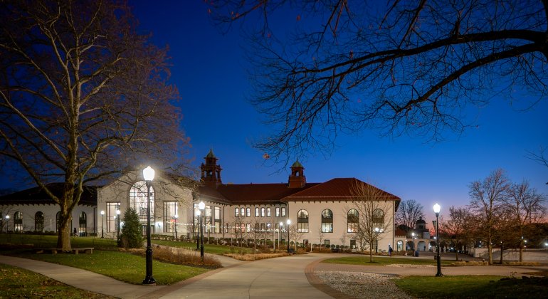 Shot of building on campus nighttime fall season.