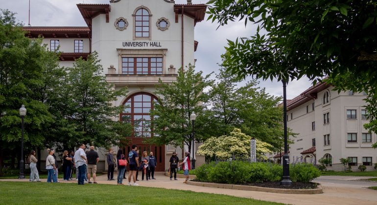 tour group standing outside of University Hall