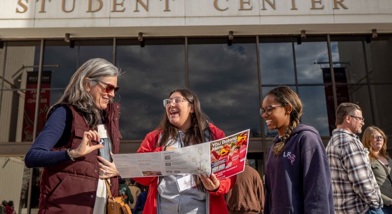 students standing in front of the student center