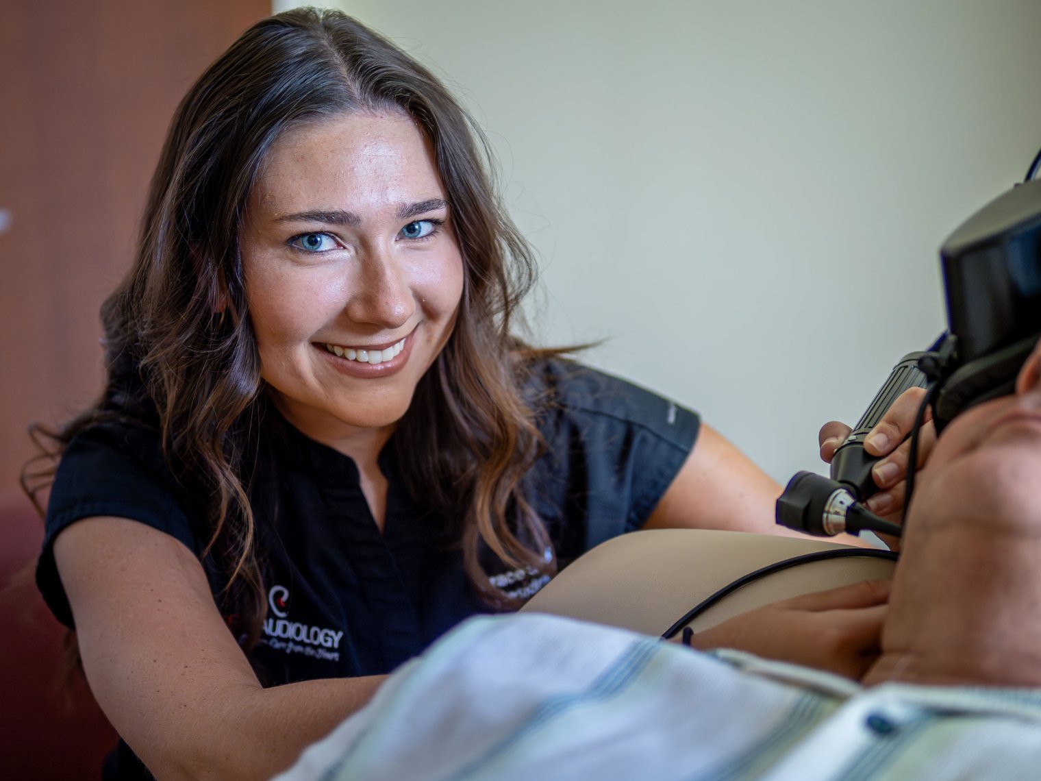 Grace Gleba examines a patient at Montclair’s Audiology Clinic.
