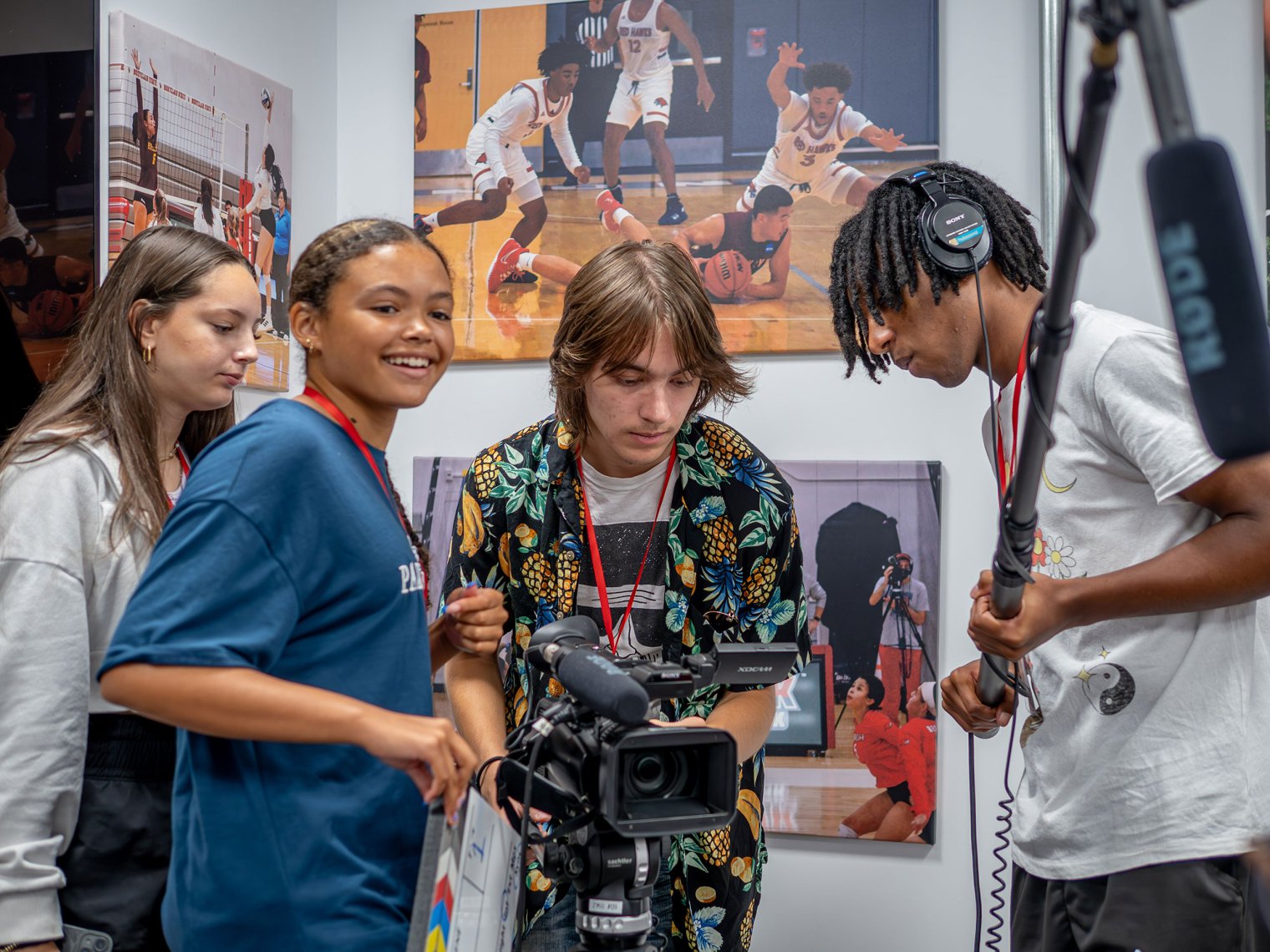 Four high school students operate professional video cameras during the Sports Communication program at Montclair’s Pre-College Summer.