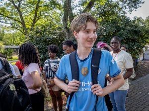 Student with a Manchester City jersey is seen at the zoo. 