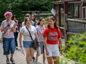 Students visiting a zoo in a group.