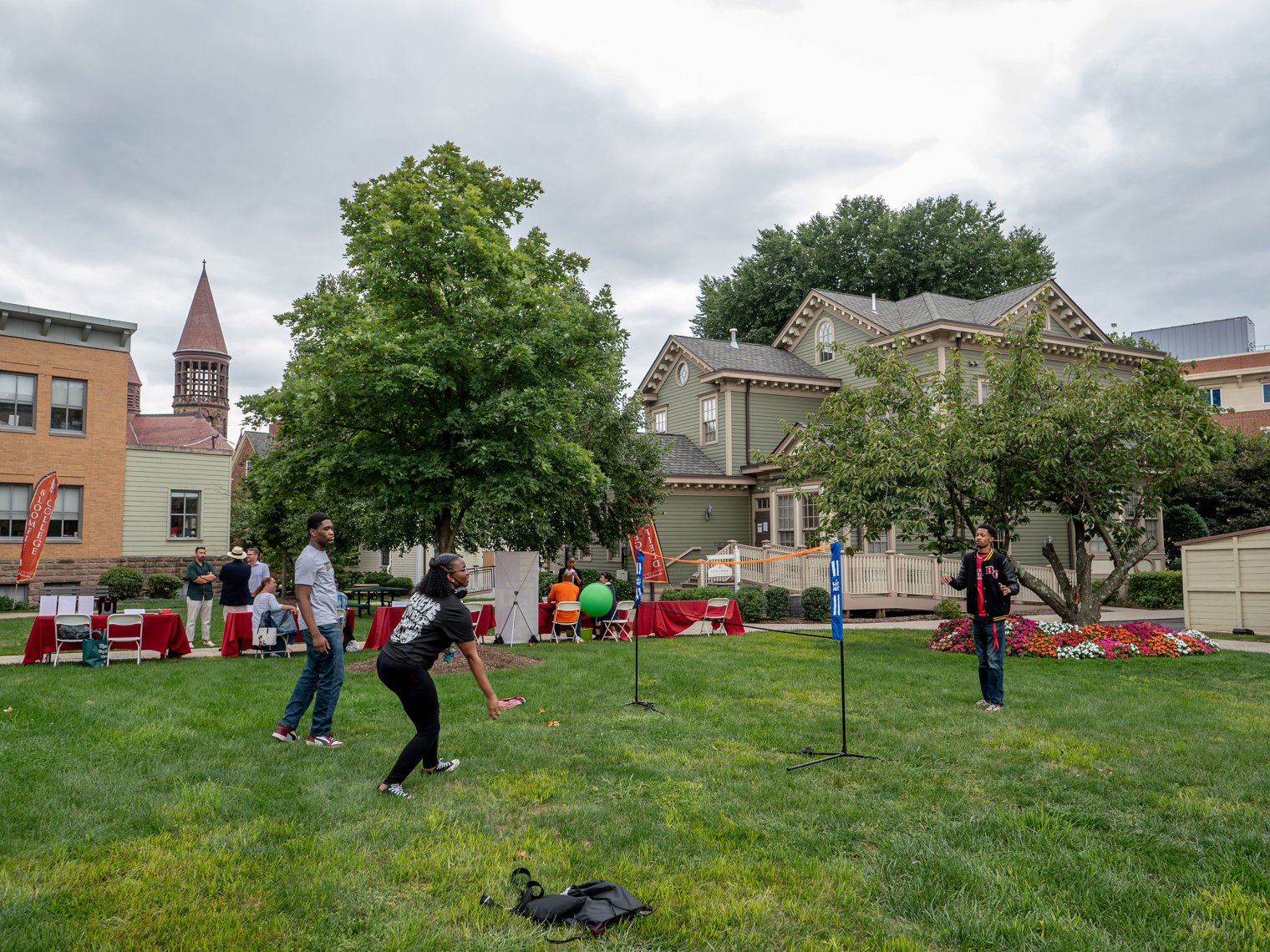 Students are seen playing on a field. 