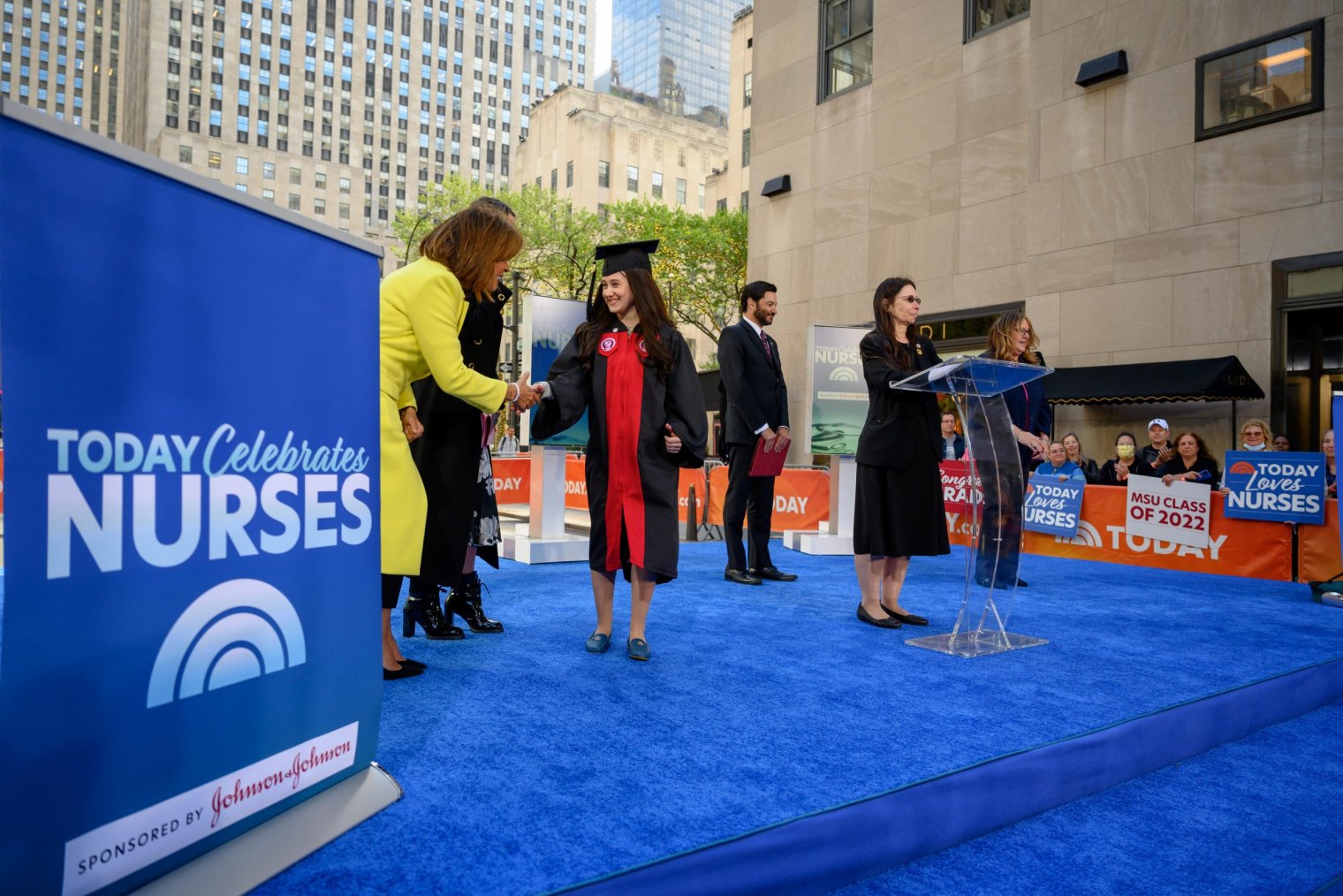 Nursing graduate Carin Adler shaking hands with Today Show host Hota Kotb