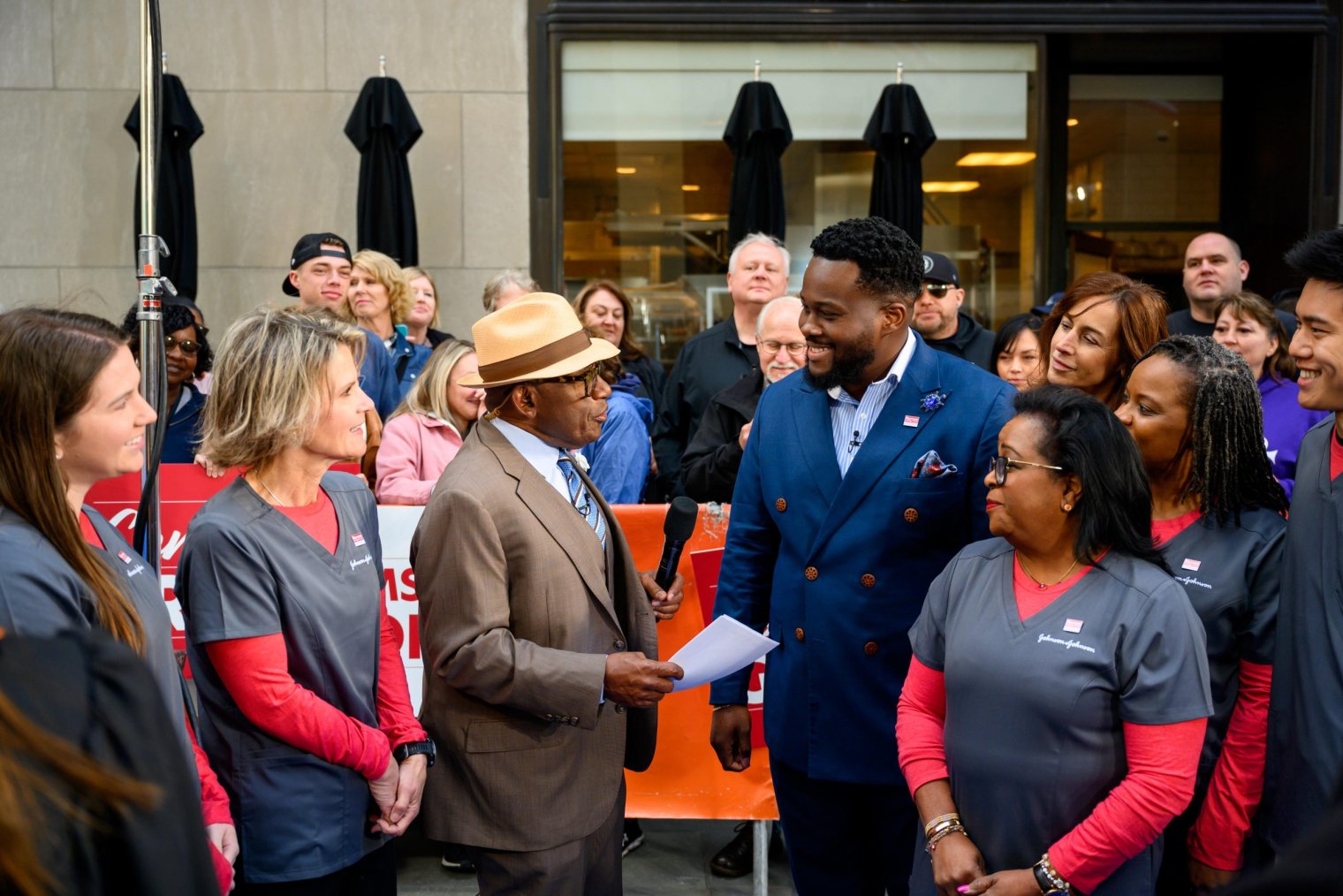 Al Roker (in the hat) interviews a team from Johnson & Johnson about the donation they gave to the School of Nursing. Photo: Nathan Congleton.