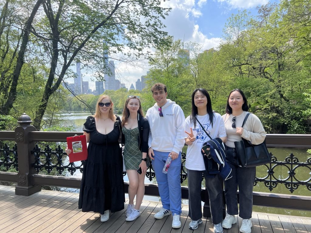 A group of international students on a bridge in New York City’s Central Park.