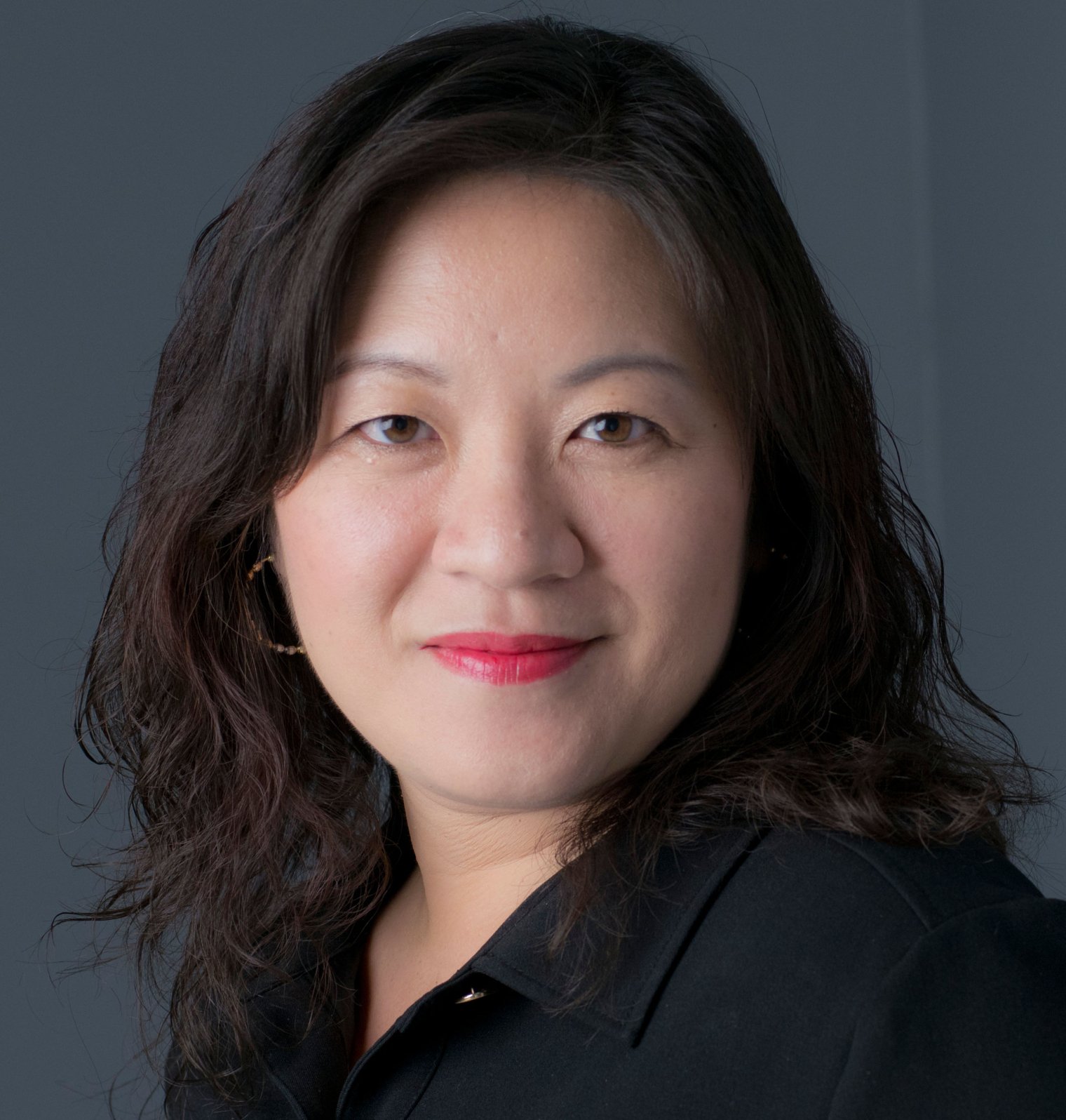 Meiyin Wu smiling with a black button down.