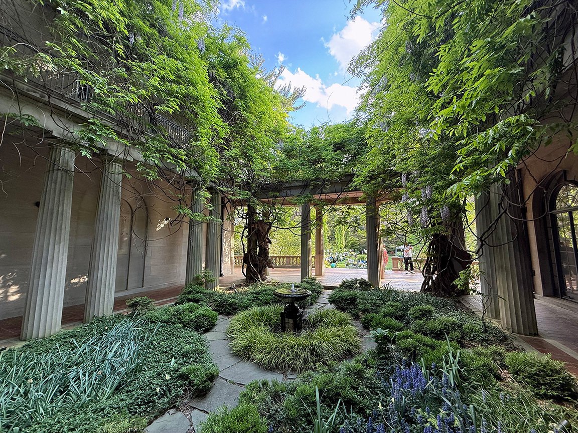 Wisteria Courtyard, featuring columns, at Van Vleck House & Gardens.