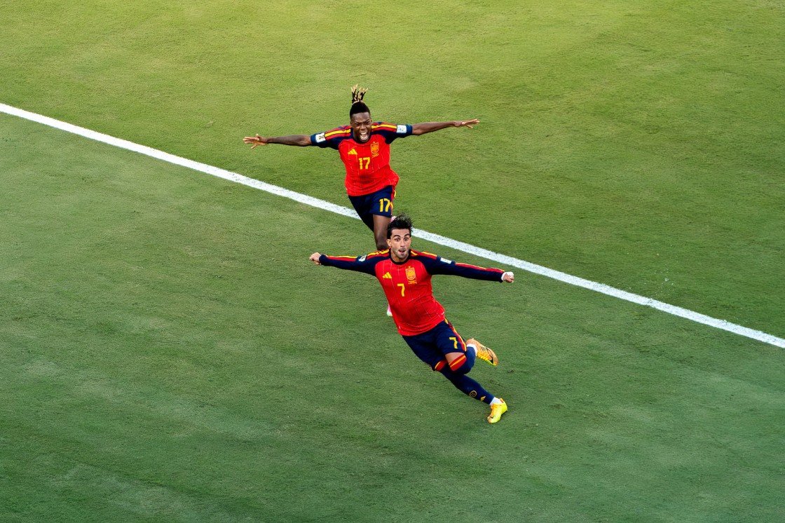 Two players from Spain Spain celebrate after scoring the lone goal that crowned the country the World Cup champions.